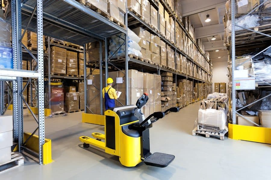 Warehouse operators moving palletised cargo
